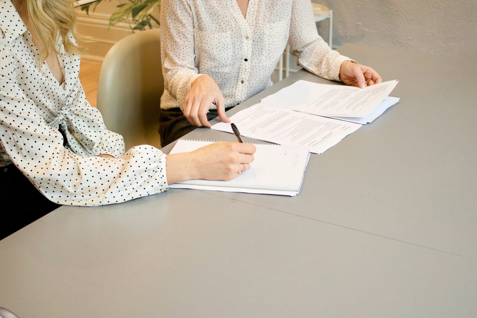 Person signing a legal document