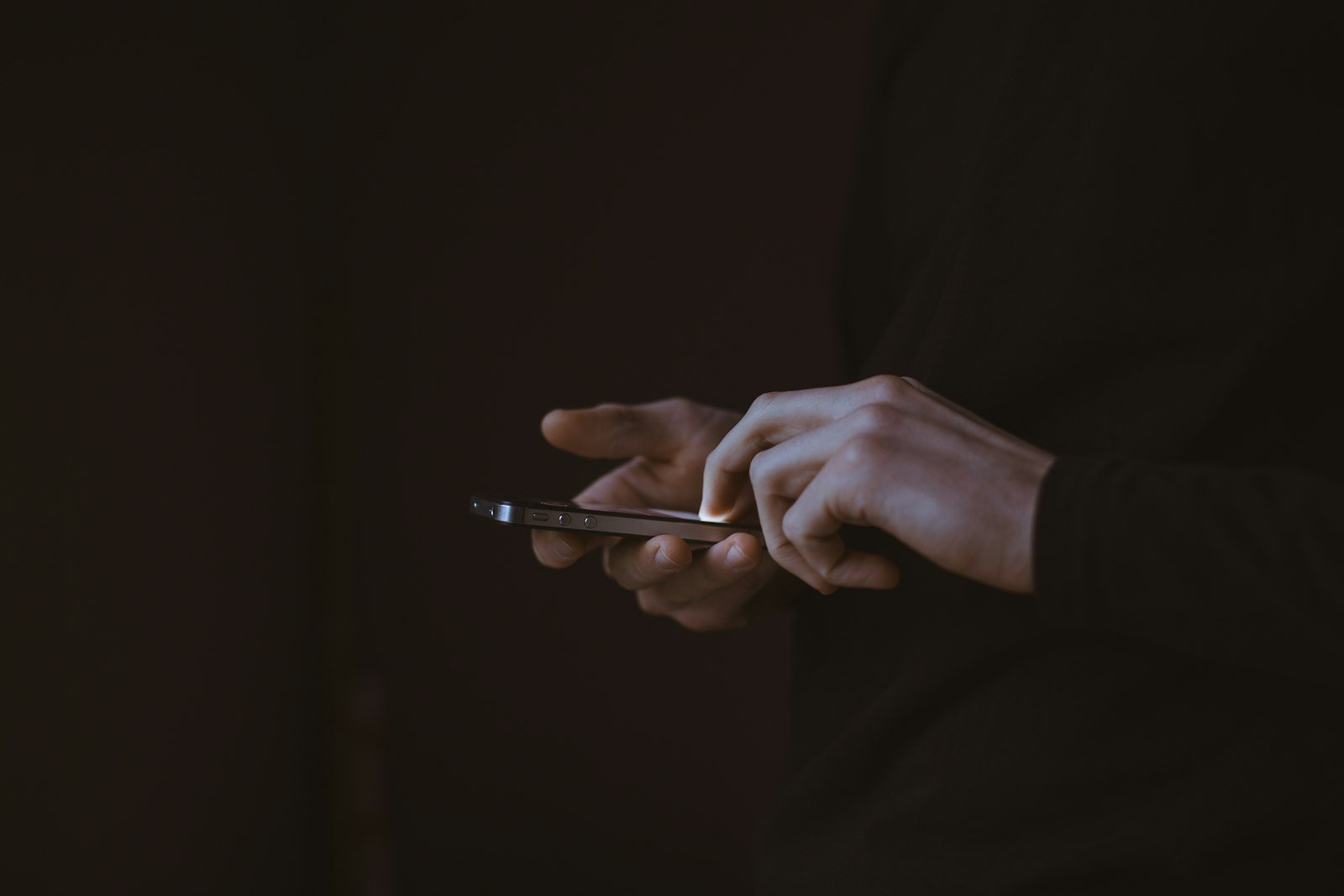 Hand interacting with a smartphone
